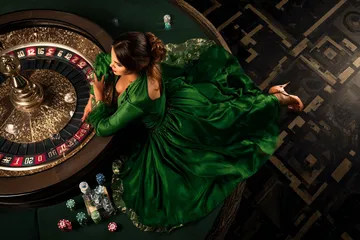 A cheerful woman in traditional clothing using her smartphone during a festive moment, showing how easily the JILI696 app fits into everyday life.